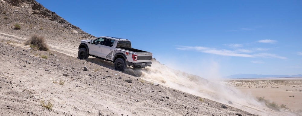 Ford F-150 Raptor driving up a hill