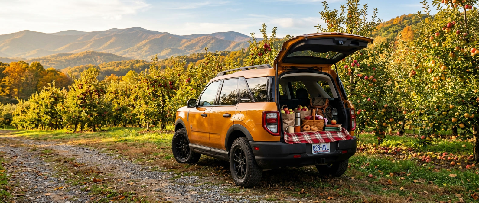 2026 Ford Bronco Sport at a Hendersonville NC apple orchard with Blue Ridge mountains in the background