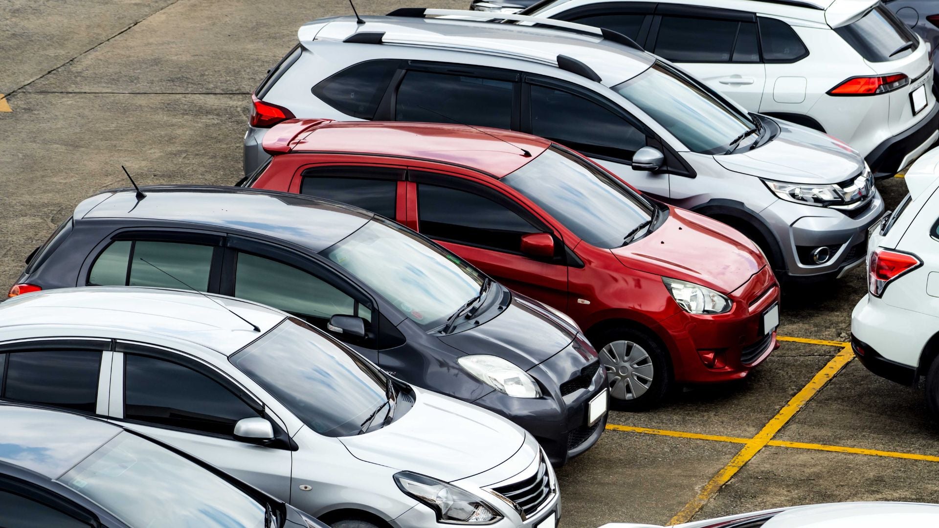 a used car dealership lot with ford and other vehicle manufacturers